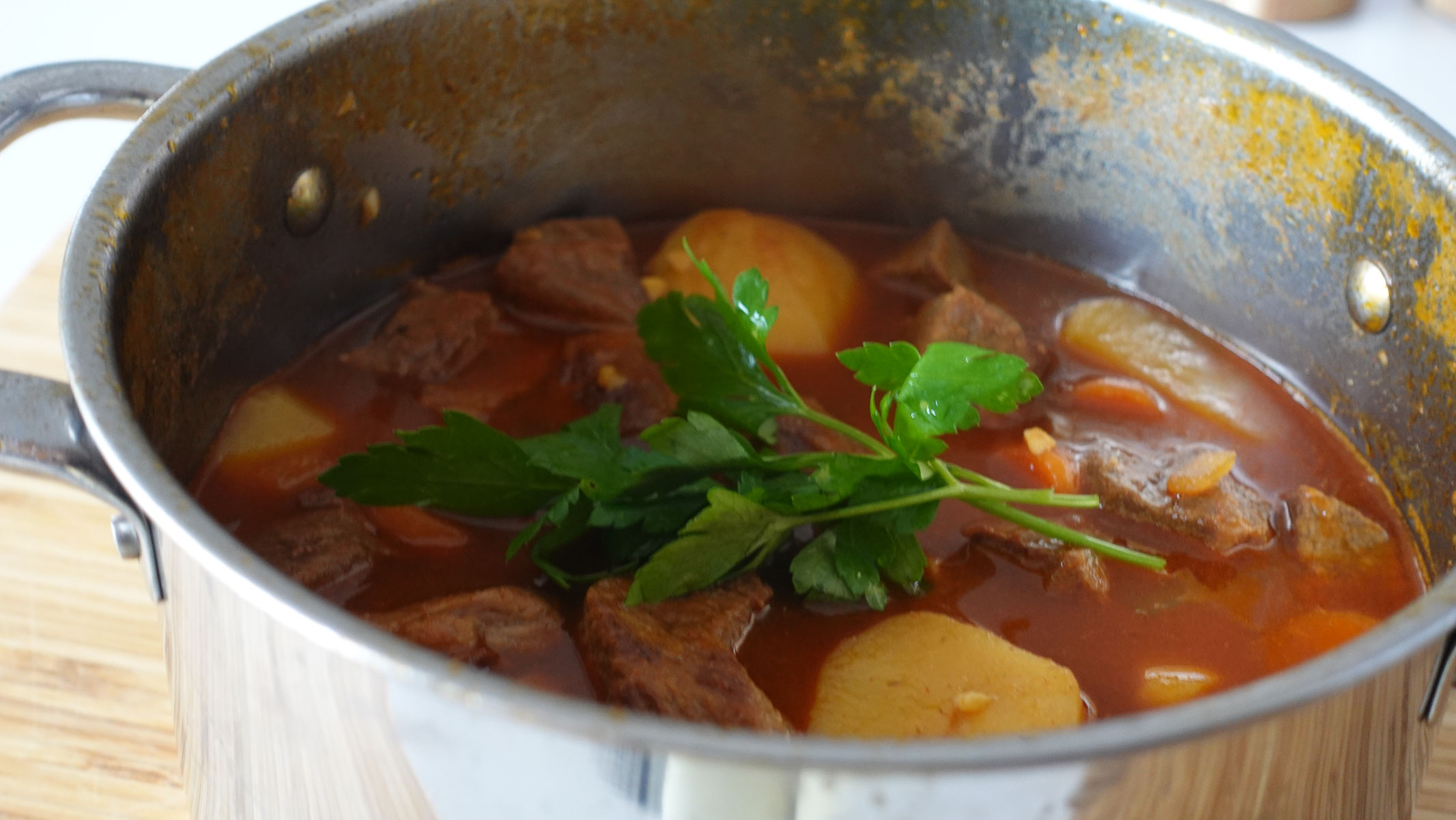 Beef carrot potato stew in a big pot.