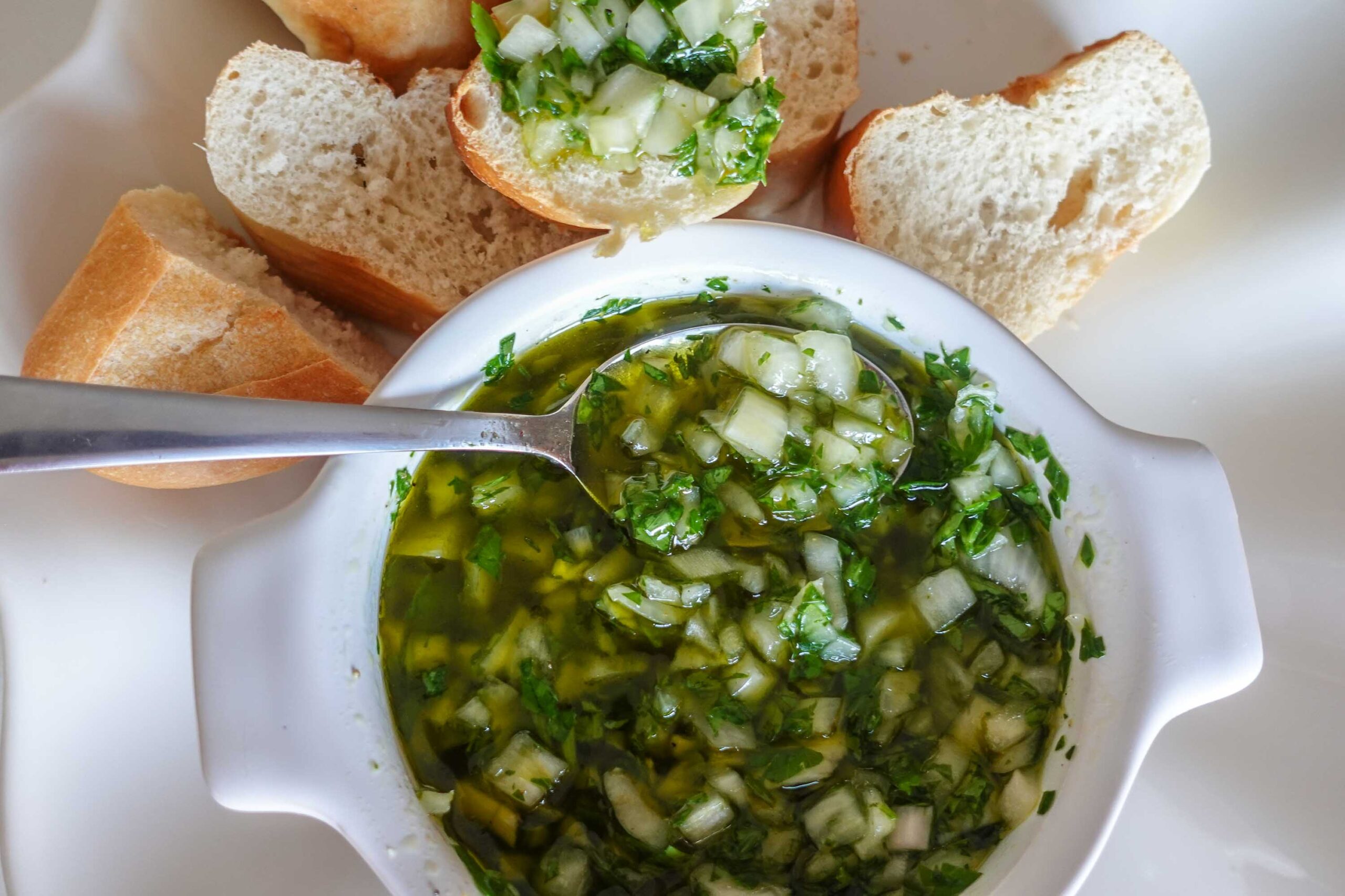 Salsa Verde with bread on a plate