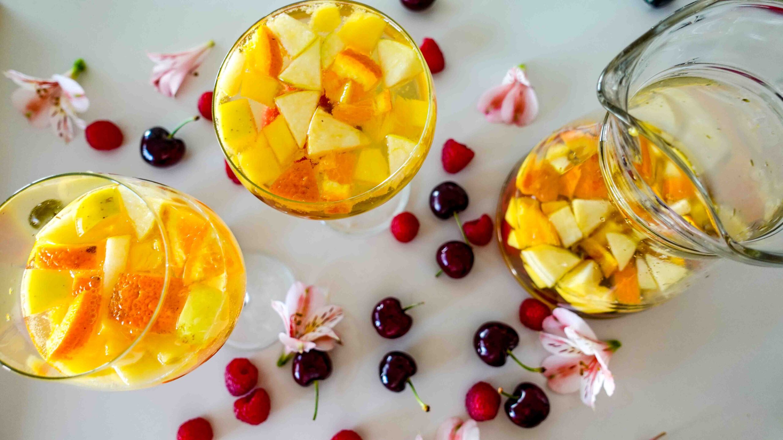 Sparkling Sangria in two glasses and a jar
