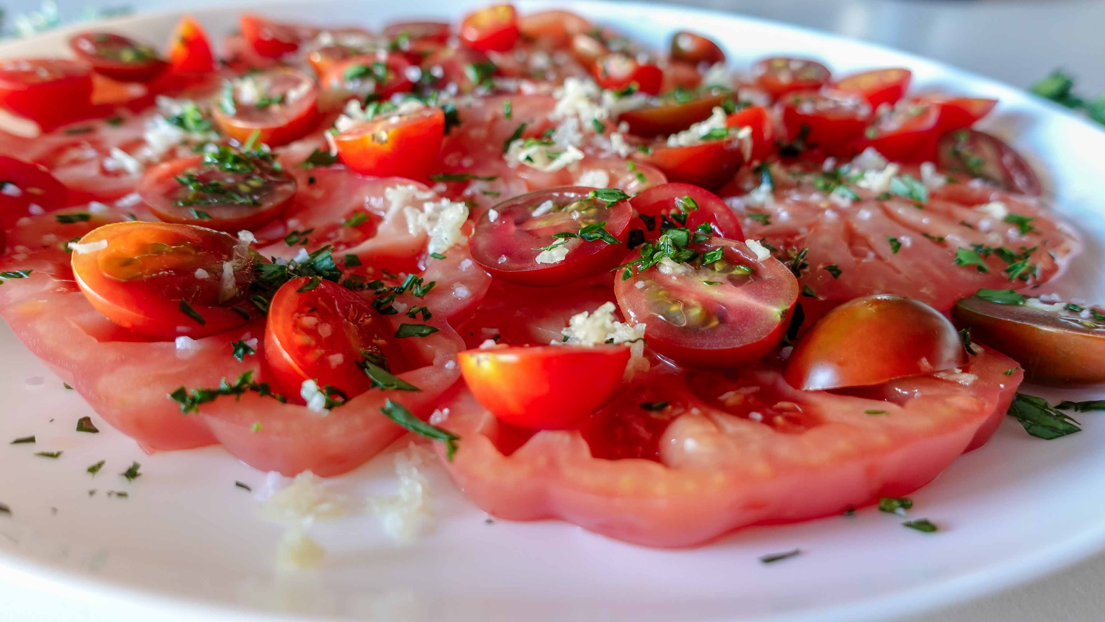 Delicious garlic tomato salad on a plate