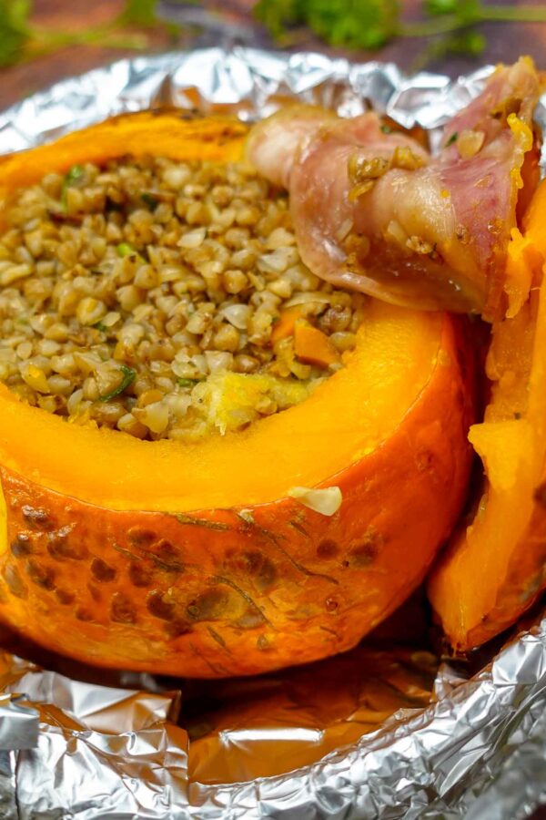 Delicious Stuffed Pumpkin in a pan with a piece of bacon.