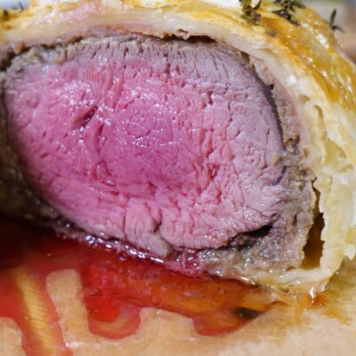 Beef Wellington with juicy meat inside the puff pastry.
