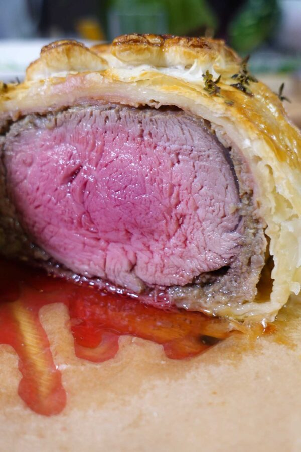Beef Wellington with juicy meat inside the puff pastry.