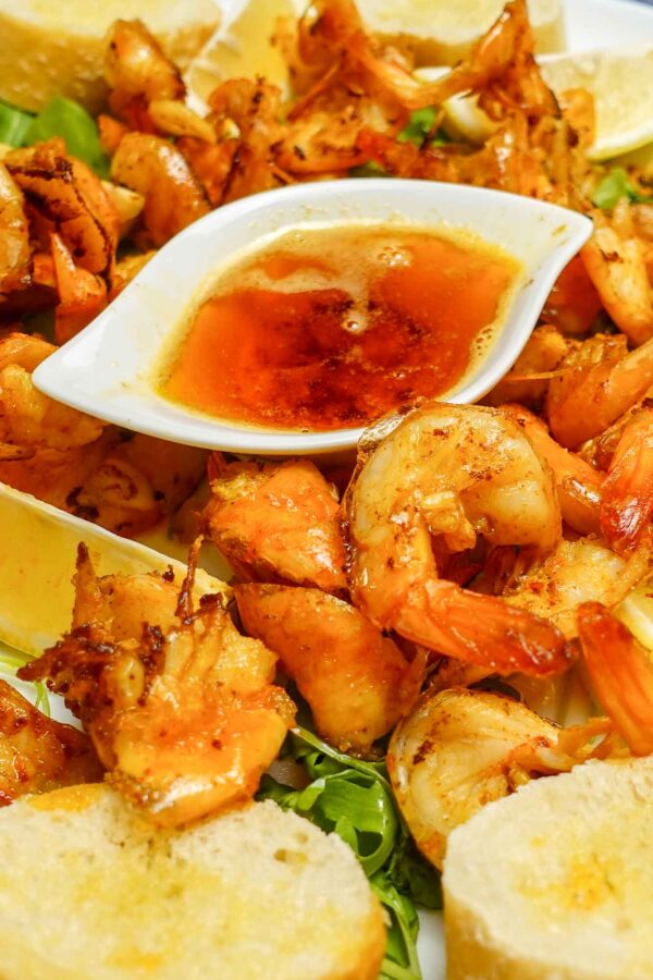Garlic Butter Shrimp with a bowl of sauce.